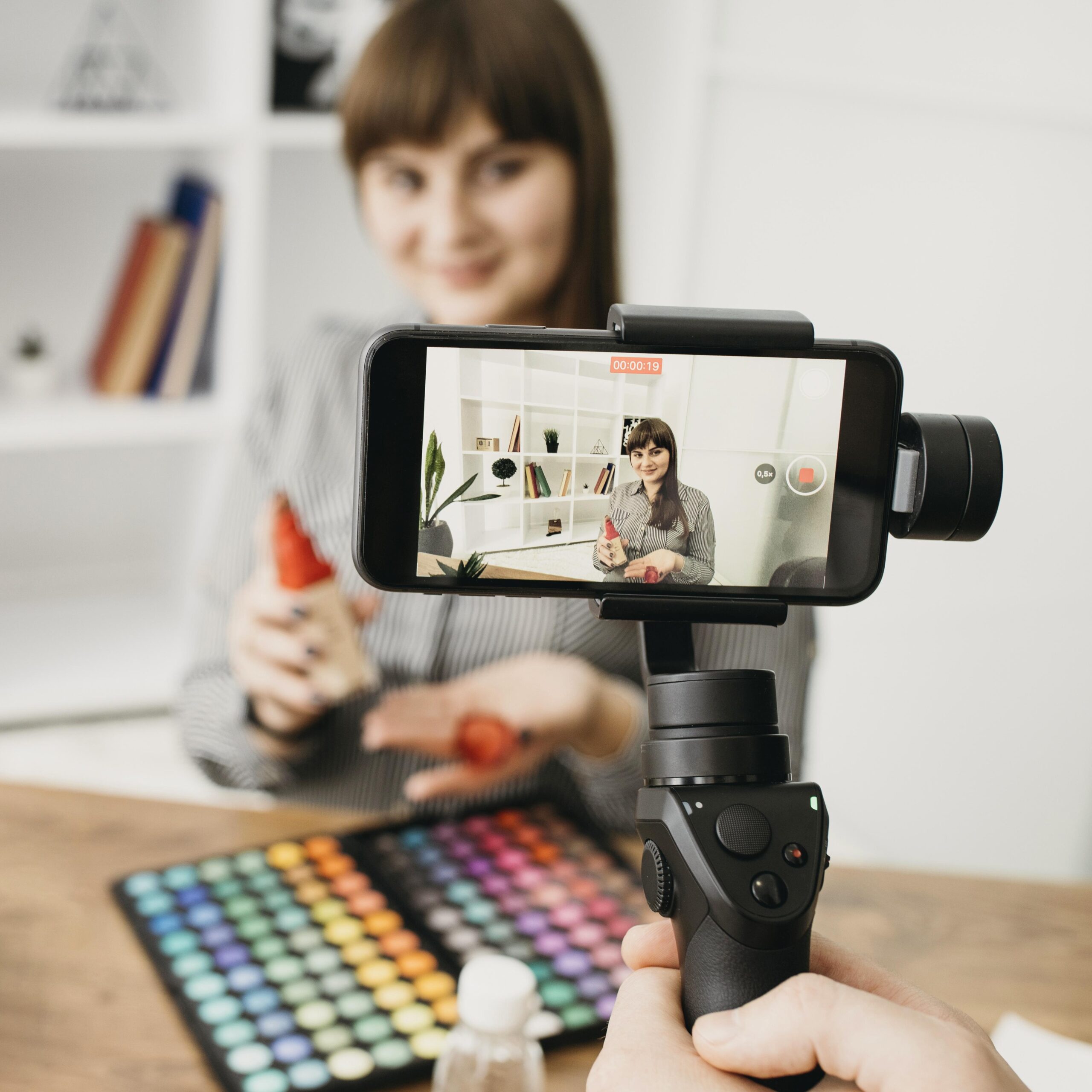 female-make-up-blogger-with-streaming-with-smartphone